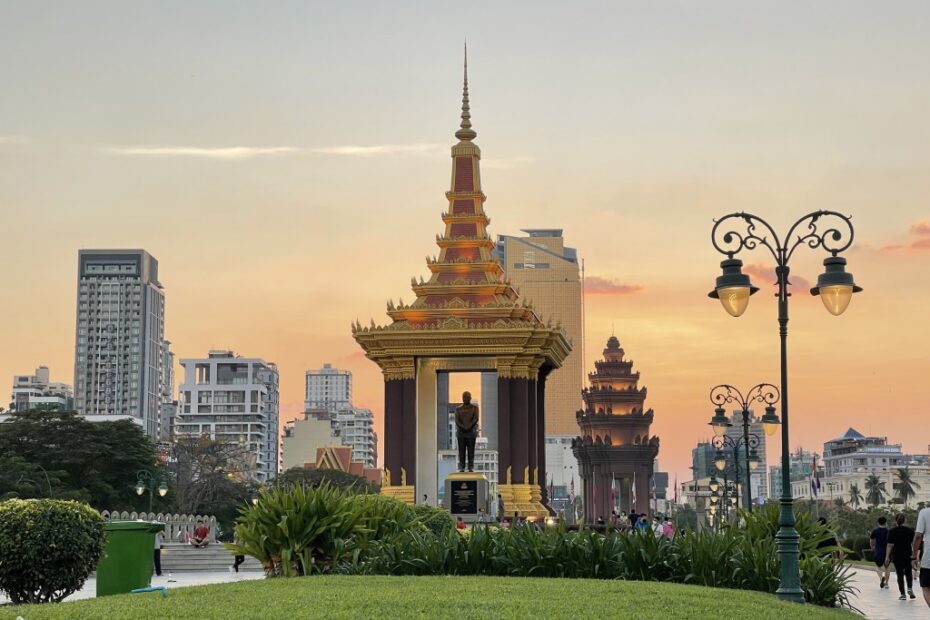 Independence Monument in Phnom Penh at night with fountains