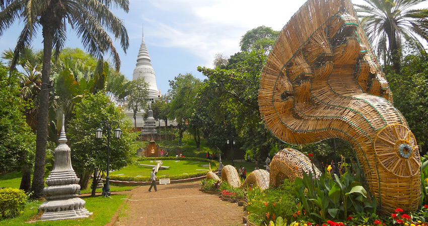 Wat Phnom Buddhist temple surrounded by lush greenery in Phnom Penh